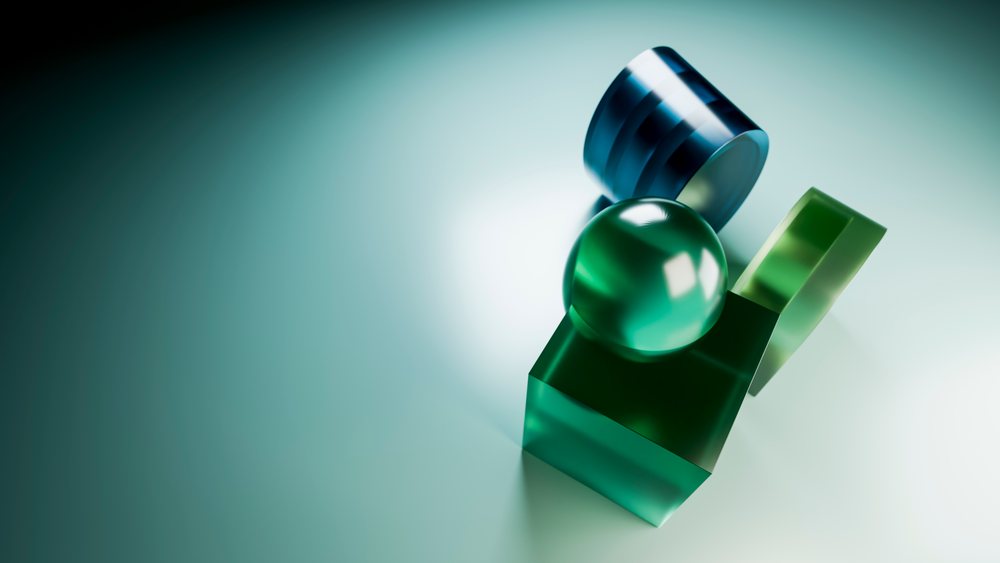 Abstract digital illustration of green and blue geometric 3D shapes arranged on a smooth gradient surface with reflections.
