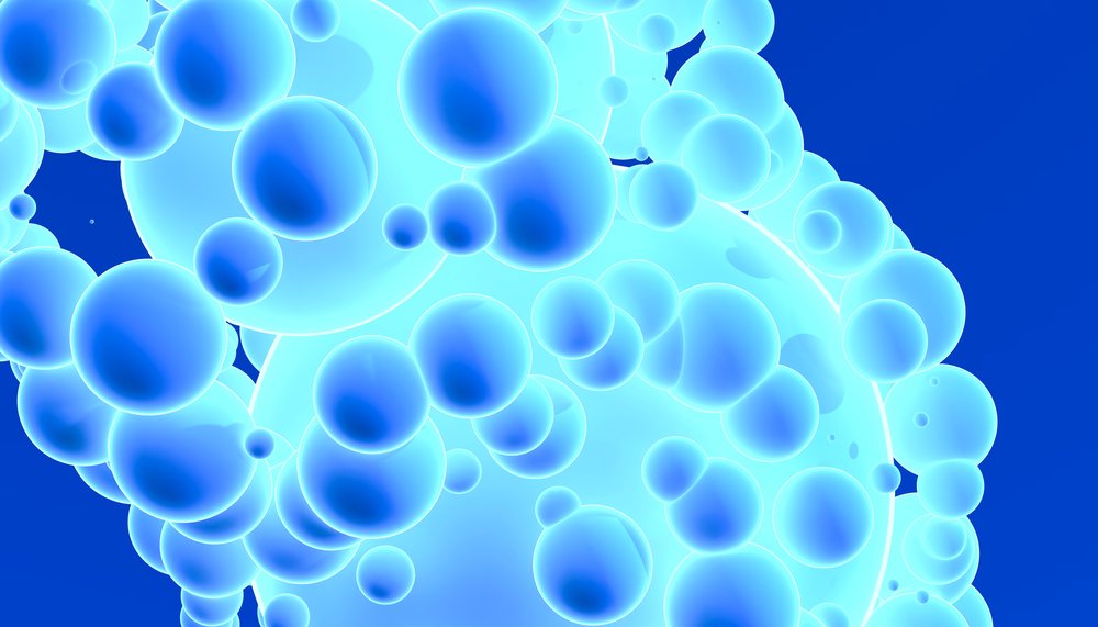 Cluster of glowing blue spheres with varying sizes floating on a blue background.