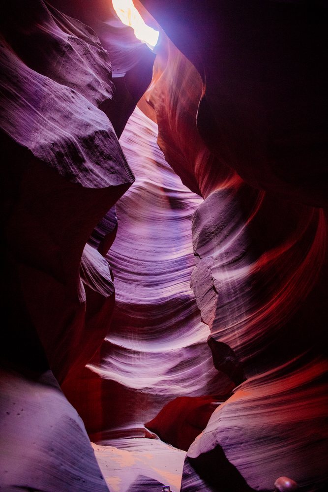 Narrow sandstone walls and natural light define the scenic Antelope Canyon slot canyon, Navajo Land, Arizona, USA.