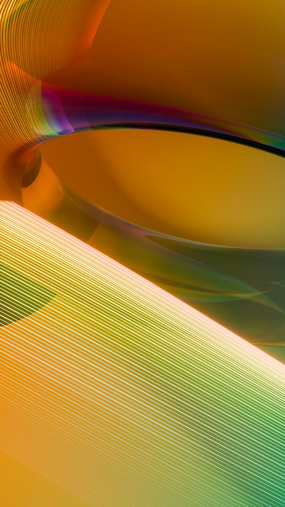 Digital abstract illustration displaying smooth flowing curved lines with orange, green, purple, and yellow gradient colors.