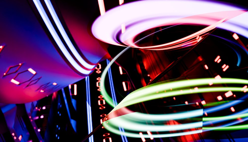 Colorful abstract light trails and neon shapes create a dynamic and vibrant scene with a dark background.