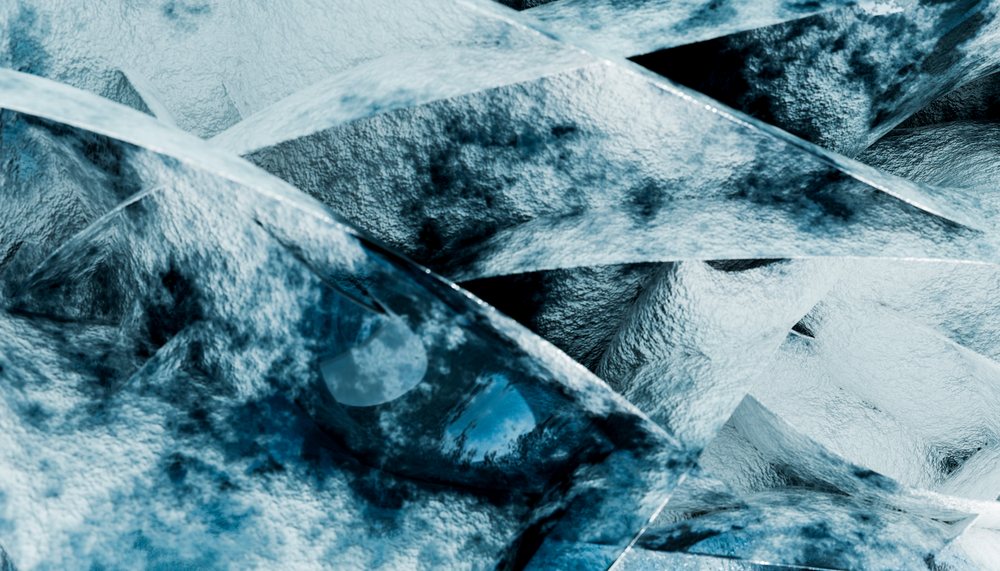 Close-up of blue ice cubes showing frosted texture and transparency.