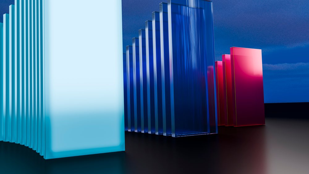 3D digital illustration of blue and pink transparent rectangular blocks arranged in parallel rows on a reflective surface.