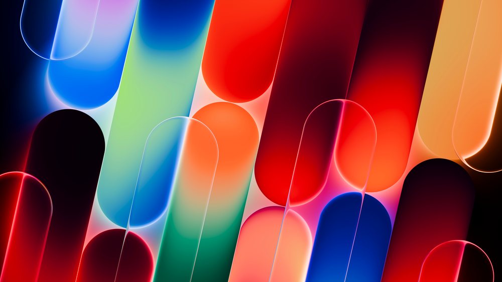 Abstract digital art with glowing colorful rounded shapes and soft gradient transitions on a dark background.