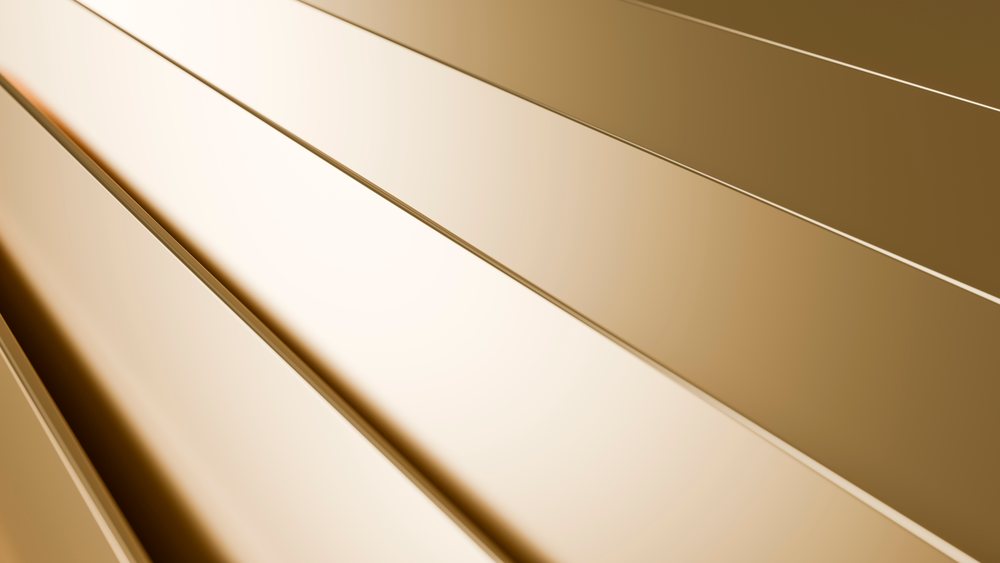 Shiny gold rectangular metal panels arranged linearly create a luxurious abstract decorative background.