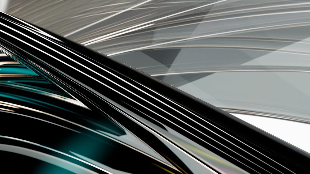 Abstract digital art with black, white, and gray smooth curved lines and reflective geometric shapes.
