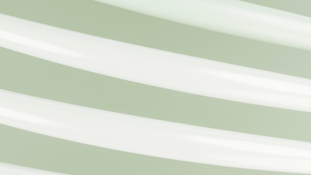 Abstract curved white lines on a light green background create a minimalist and smooth textured design.