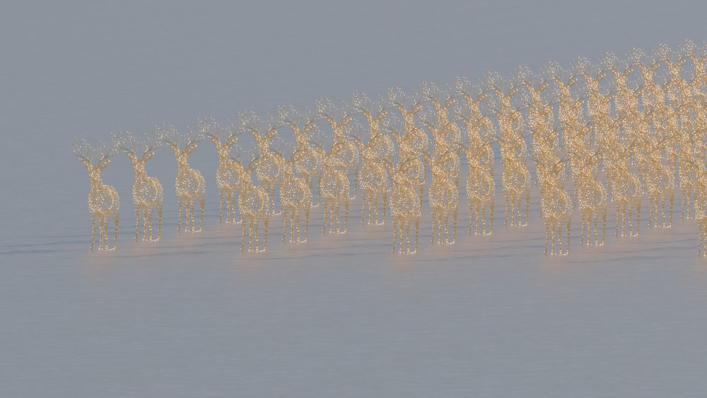 Group of illuminated reindeer wireframe sculptures with lights in a winter setting.