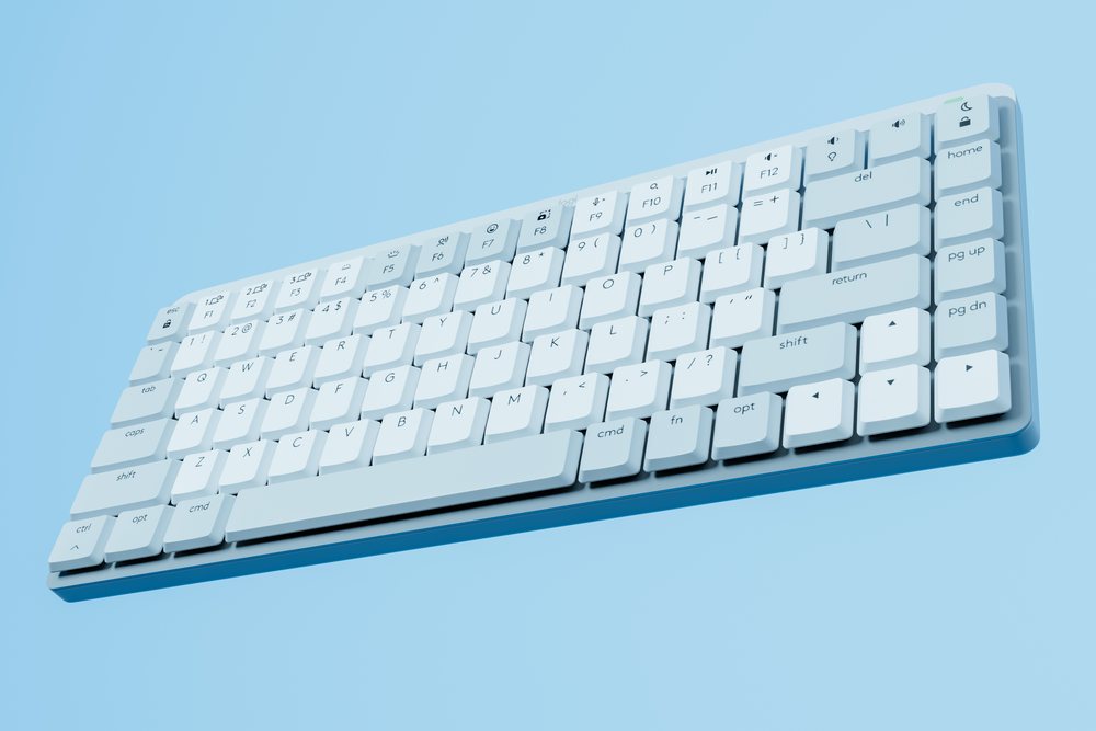 Wireless white keyboard on a blue background with modern keys and function buttons, abstract render background.