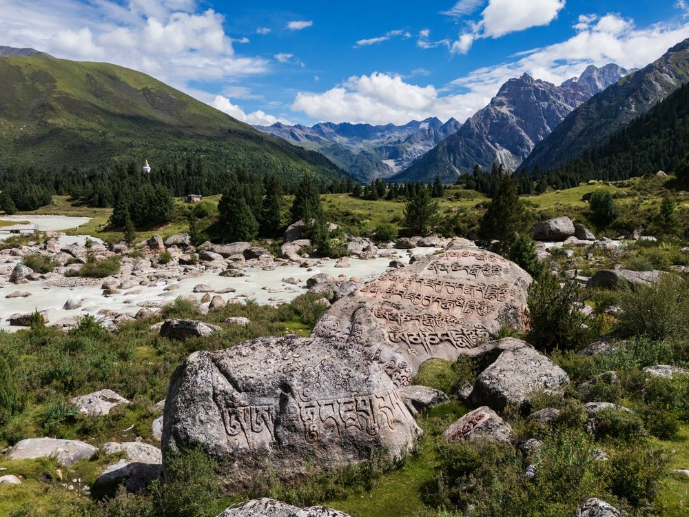 Rock carvings on stones in a mountainous valley, Cuobacun, Sichuan Province, People's Republic of China.