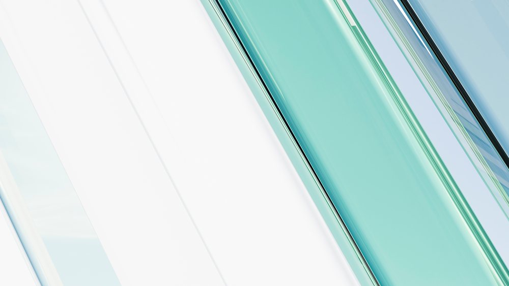 Abstract digital illustration featuring smooth, diagonal transparent glass lines in blue and green tones with a modern design.
