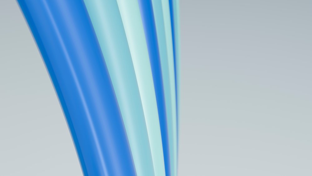 Abstract digital illustration featuring flowing blue and light blue curved lines on a smooth background.