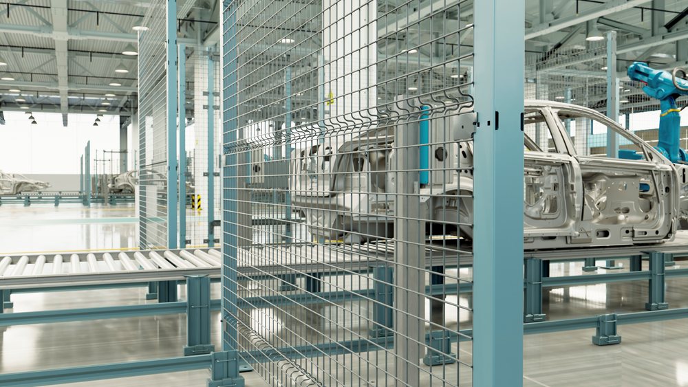 Automobile frames on an assembly line with robotic arms inside a modern manufacturing factory, car, industry.