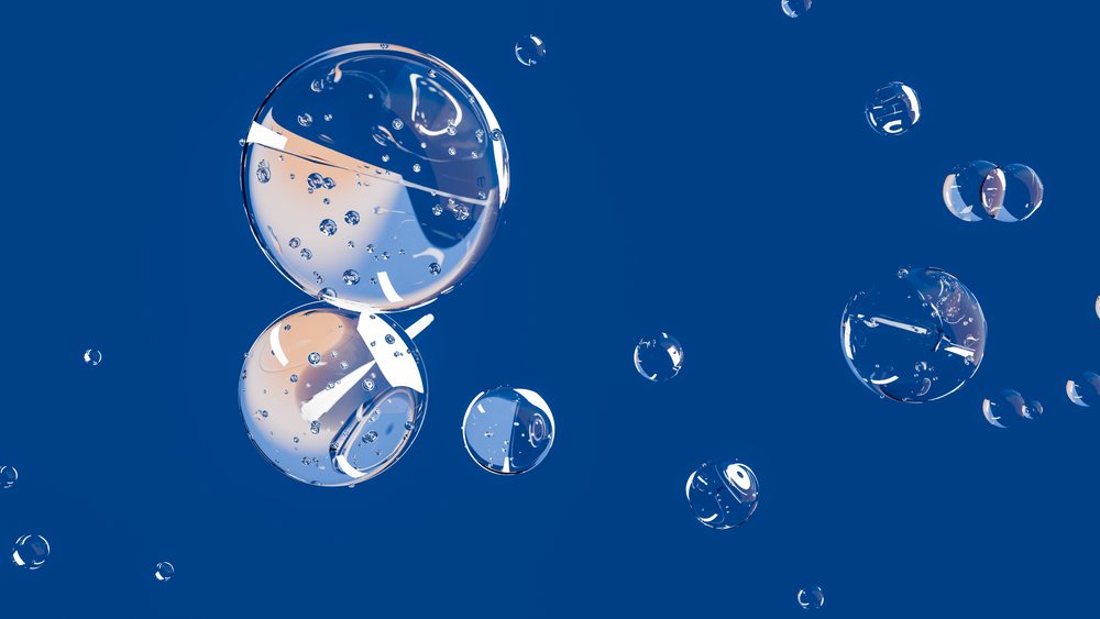 Transparent bubbles with visible internal air reflections float against a blue background.