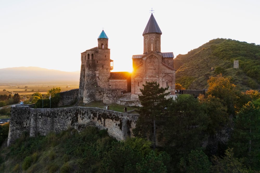 Gremi Monastery and stone fortress with towers on a hill at Sunset, Sighnaghi, Georgia.
