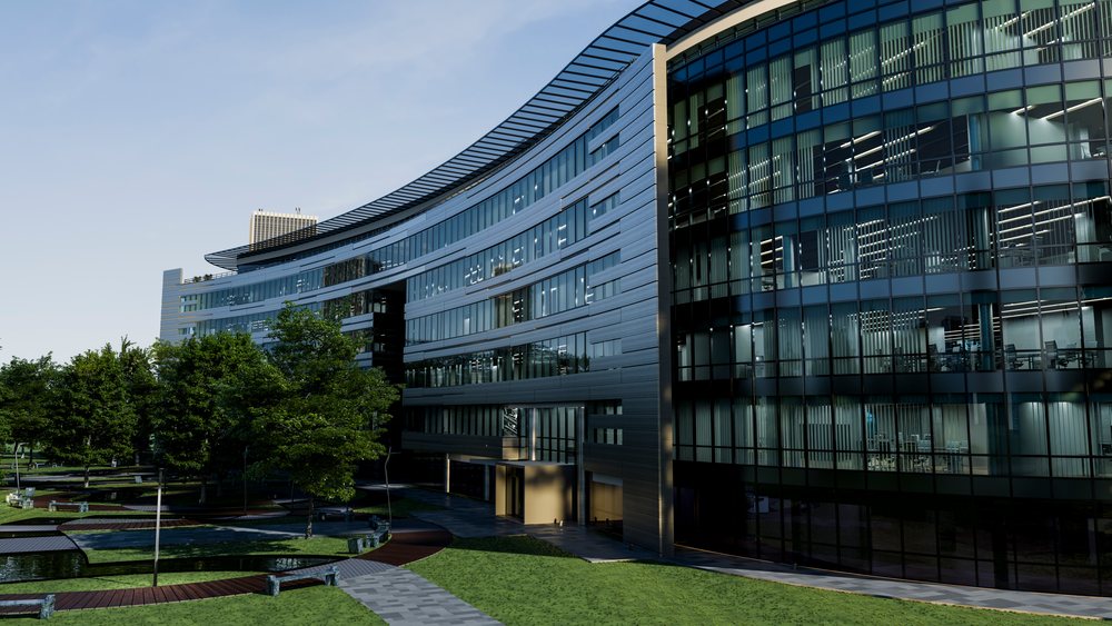 Modern curved office building with glass facade.