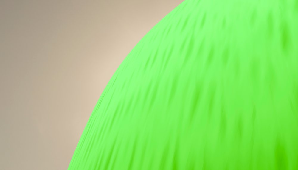 Close-up view of a bright green inflated balloon against a neutral background.