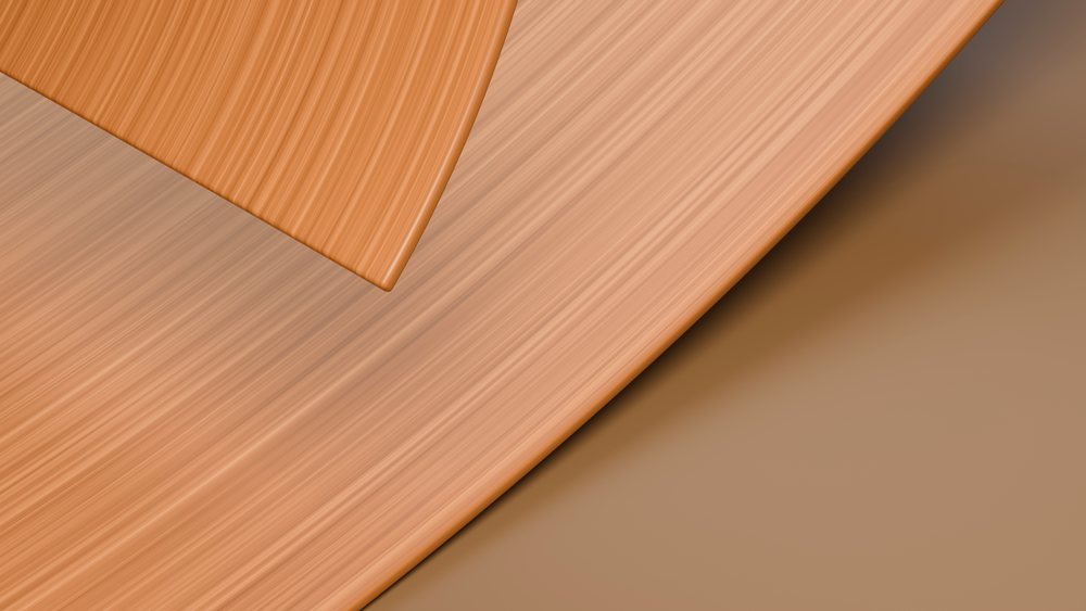 Closeup view of smooth wooden boards showing natural brown grain and texture on the surface.