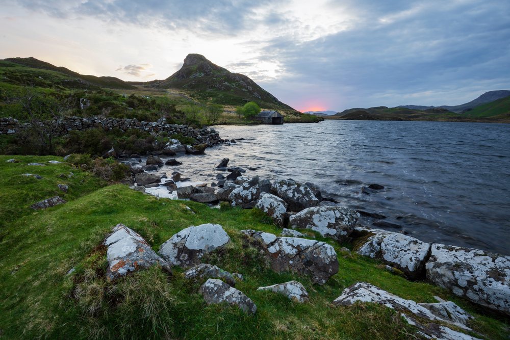 Cregennen Lakes with rocky shore and mountain at Sunrise, UK, Landscape, Dolgellau, Gwynedd, Wales.