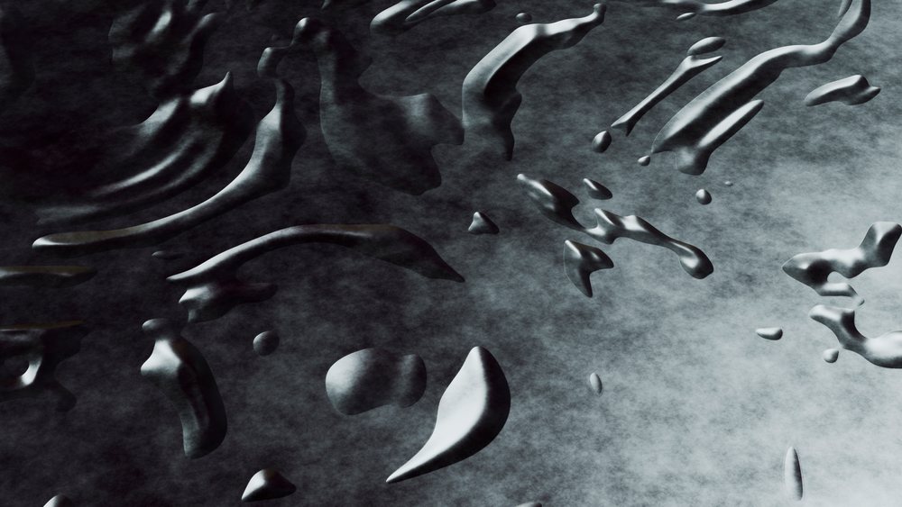 Black liquid splashing with glossy texture and irregular shaped droplets on dark surface.