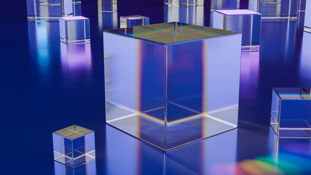 Modern digital illustration of multiple transparent glass cubes with colorful light reflections on a glossy blue surface.