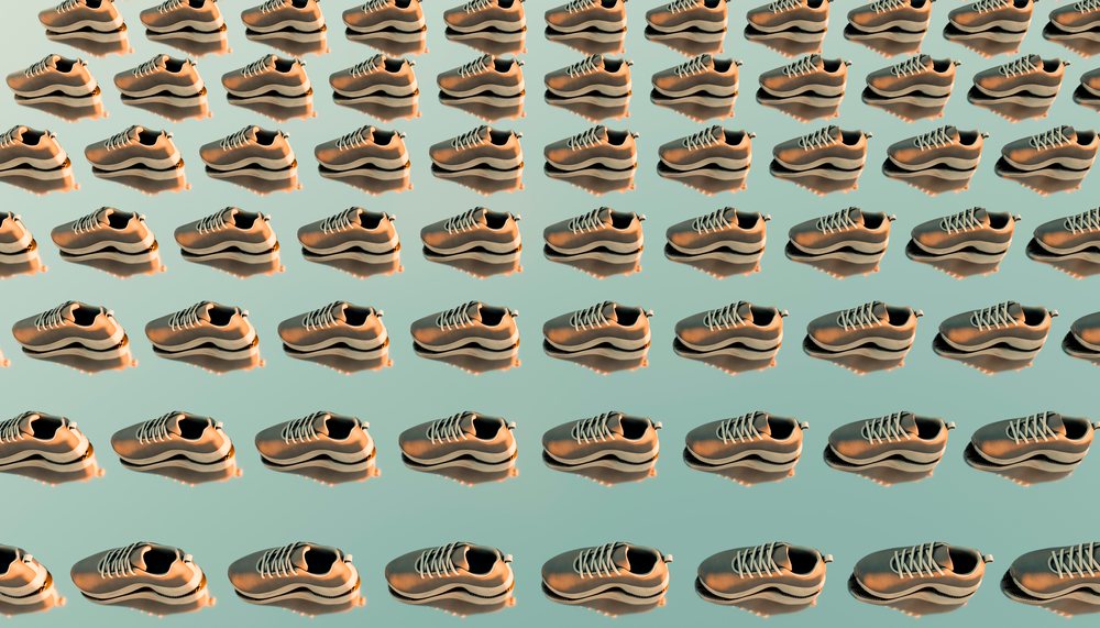 Multiple pairs of neutral-colored running shoes neatly aligned on a neutral background, forming a repetitive pattern.