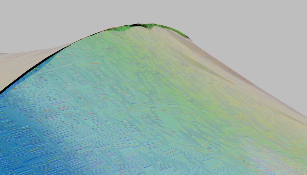 patterned curved surface with a multicolor geometric texture and pastel gradient tones.