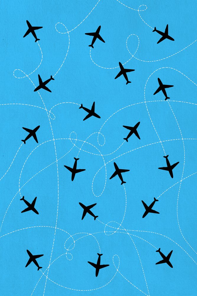 Illustration of multiple black airplane silhouettes with dashed flight paths on a blue background.