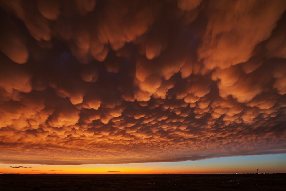 Mammatus clouds glowing at Dusk over the Great Plains, Storm Chasing, Weather, Environment, Guymon, Oklahoma, USA.