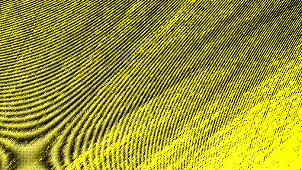 Yellow paint applied in textured brush strokes creating an abstract vibrant surface.