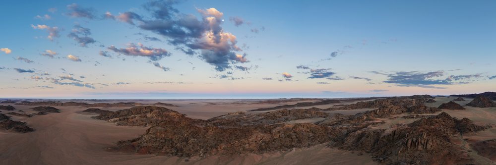 Panoramic view of Rock Gardens with rocky desert terrain and a twilight sky, landscape, wildlife, The bear at Rock Gardens, Kunene Region, Namibia.