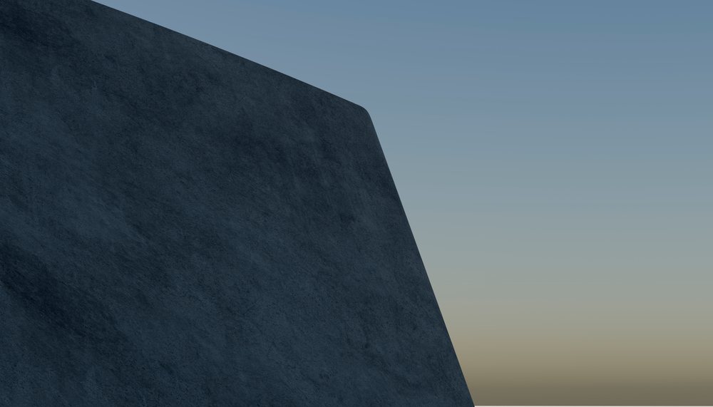 A large concrete wall of a modern building against a clear sky