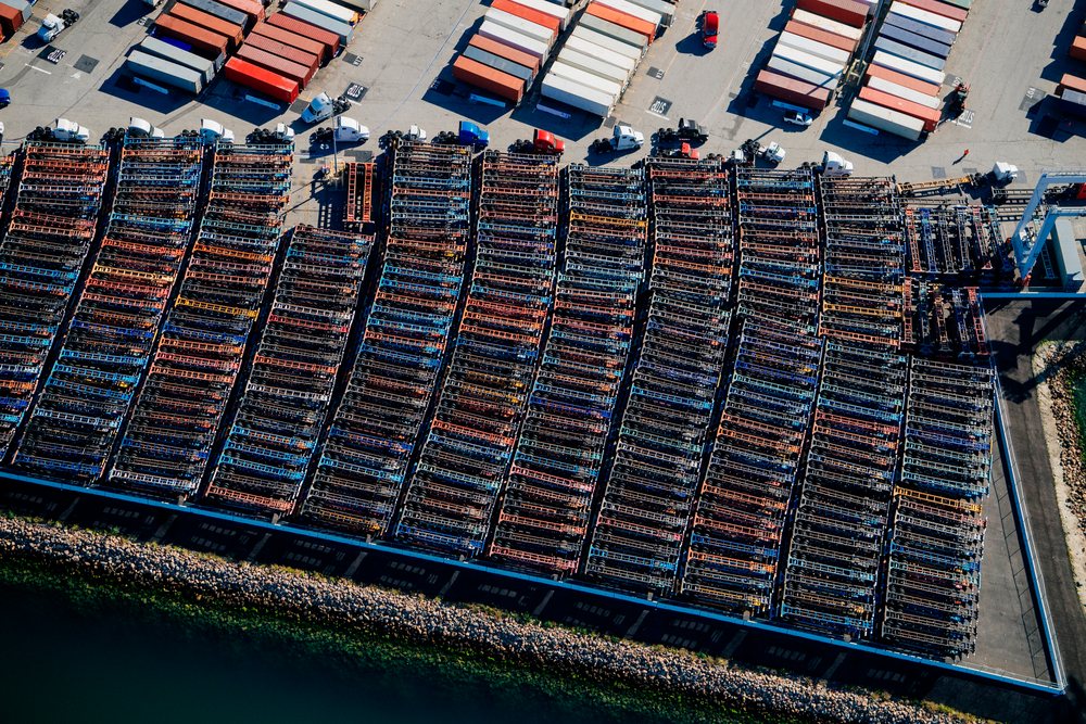 Shipping container trailers and semi trucks parked in organized rows at the, Port of Long Beach, CA, USA.