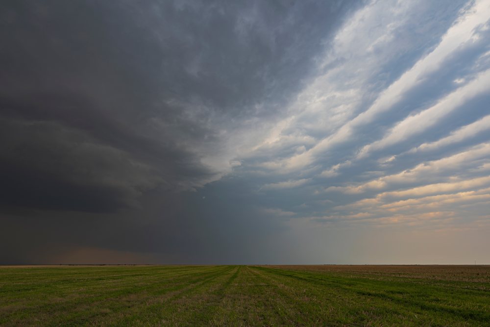 Supercell storm with a herringbone cloud pattern over a green field in Tornado Alley, Storm Chasing, Weather, Environmental issues, Anton, Colorado, USA.