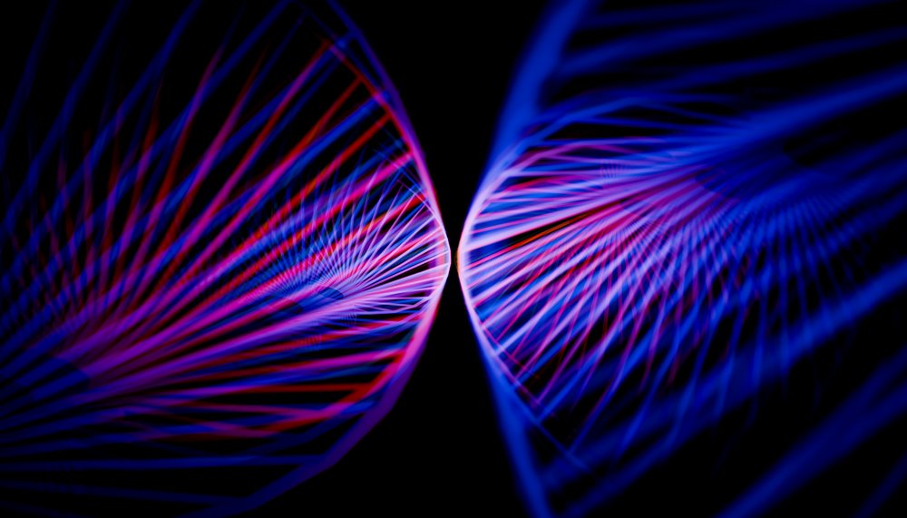 Abstract digital art featuring converging blue and pink neon light trails on a dark background.