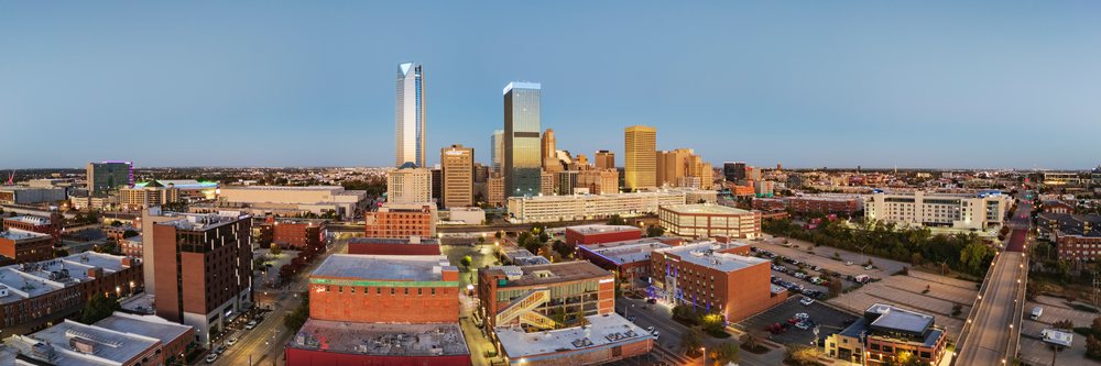 Oklahoma City Skyline viewed at Sunrise across downtown with urban buildings and roads under a clear sky, Americana, Historic, USA.