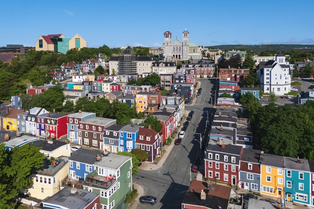 Colorful Jelly Bean Row of residential houses with a church building visible at street end, Landscape, Cityscape, Lifestyle, St John's, Newfoundland & Labrador, Canada.