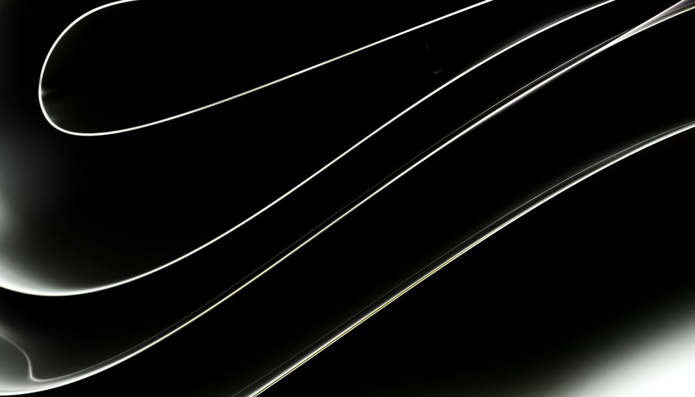 Abstract glowing curved lines on a black background with a minimalist modern design.