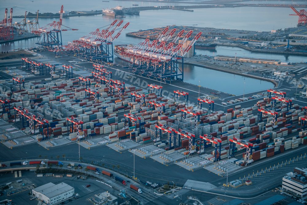 Aerial view of container cranes and shipping containers