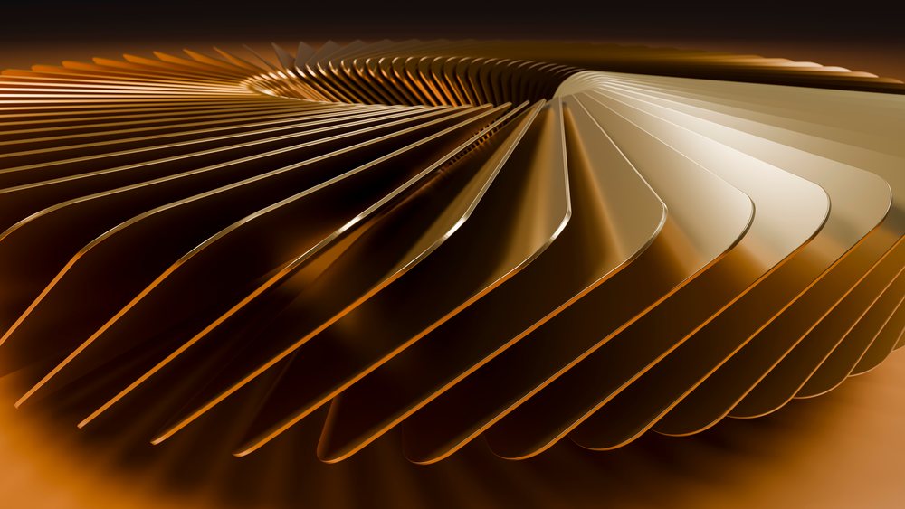 Detailed close-up of shiny gold-colored metal spirals creating an abstract decorative pattern against a brown background.