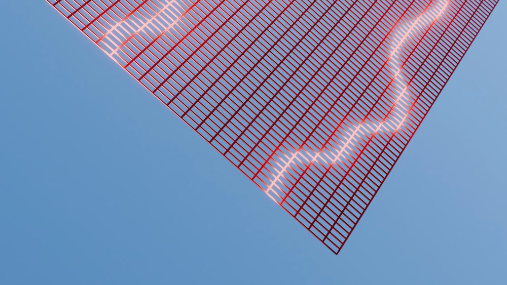 Red grid pattern with glowing wavy light line on blue background in abstract digital art.