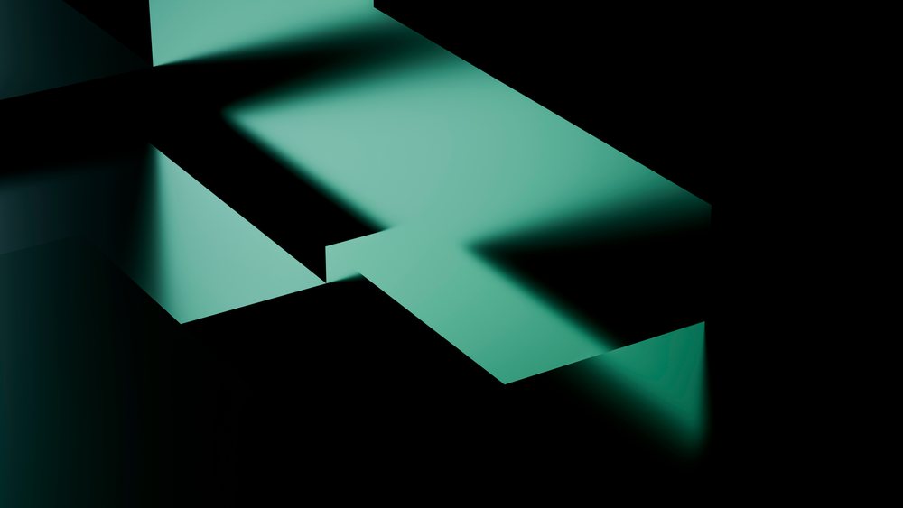 Abstract composition of green three-dimensional geometric planes casting shadows on a black background in a minimalist modern design.