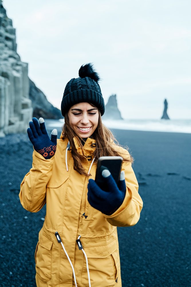 White Woman video calling on a smartphone