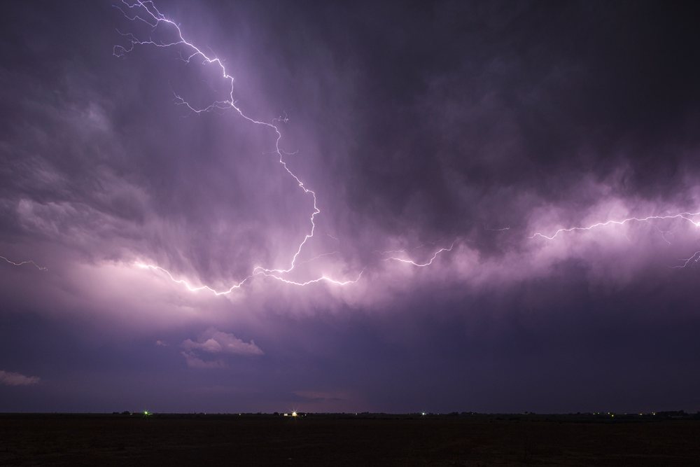 Lightning strikes across a stormy night sky over open land, Storm Chasing, Weather, Environment, La Junta, Colorado, USA.