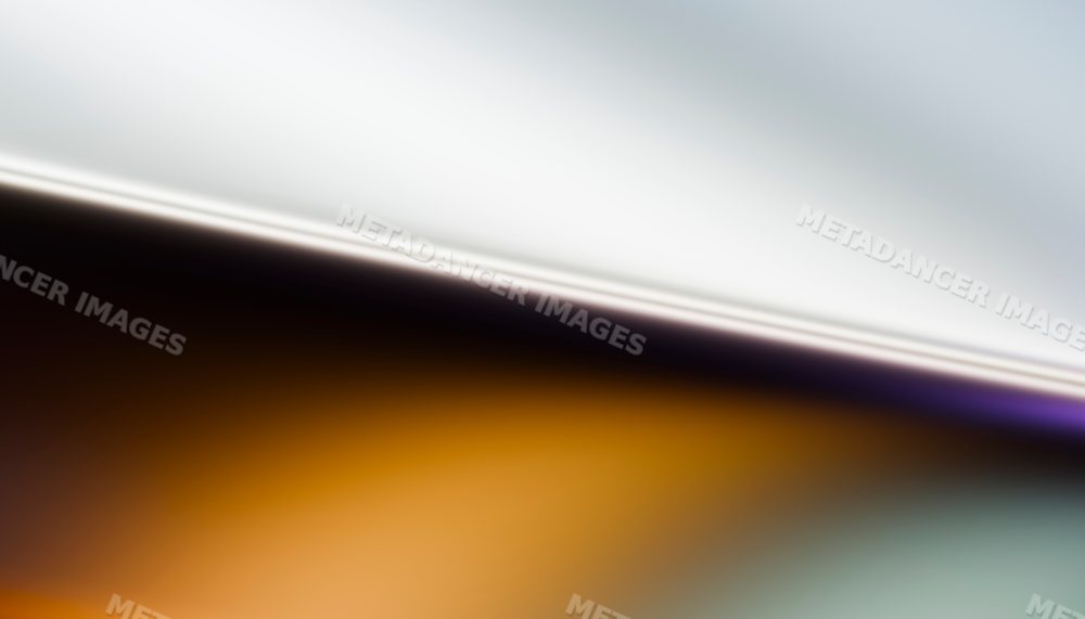 Abstract gradient of warm orange blending smoothly into soft gray