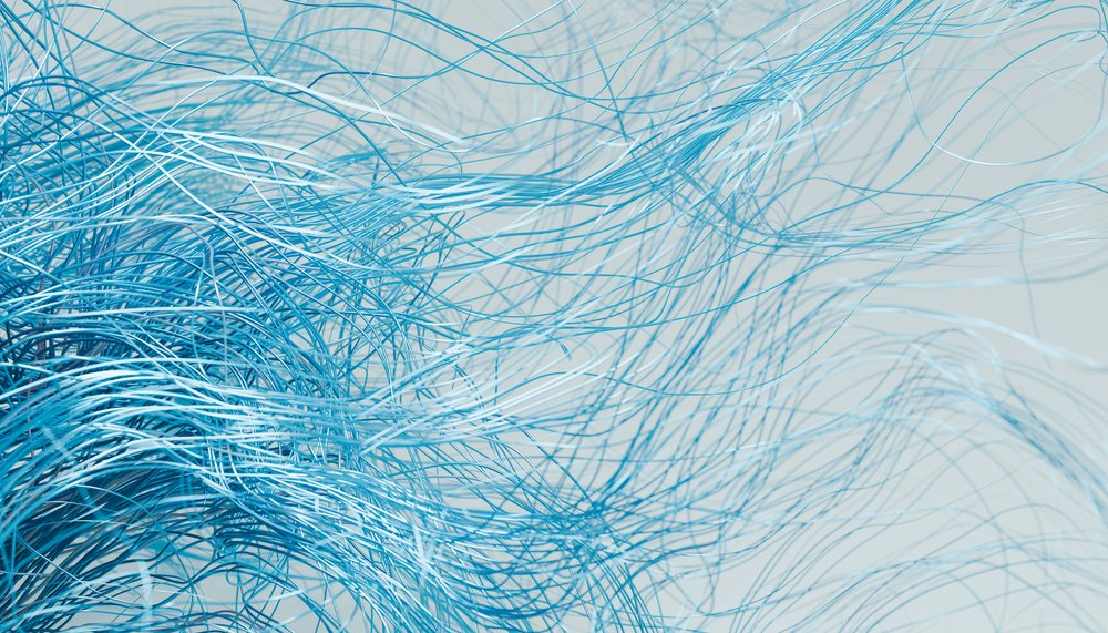 Blue flowing and tangled strands creating an abstract dynamic pattern on a light background.