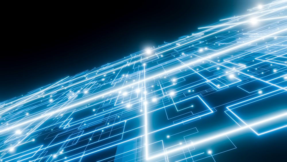 Glowing blue circuit lines form an abstract digital network on a dark surface.