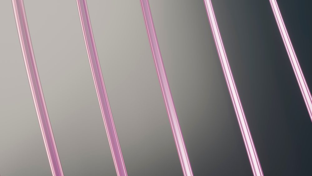 Parallel pink neon tubes emit bright glow forming a modern abstract geometric lighting pattern with ambient illumination.
