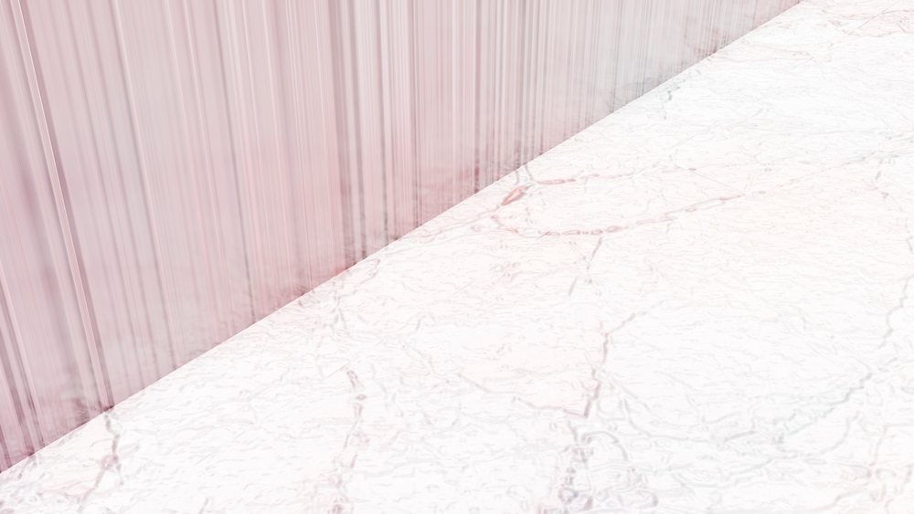 Pink curtain hanging next to a white marble floor with intricate veining in an indoor space.