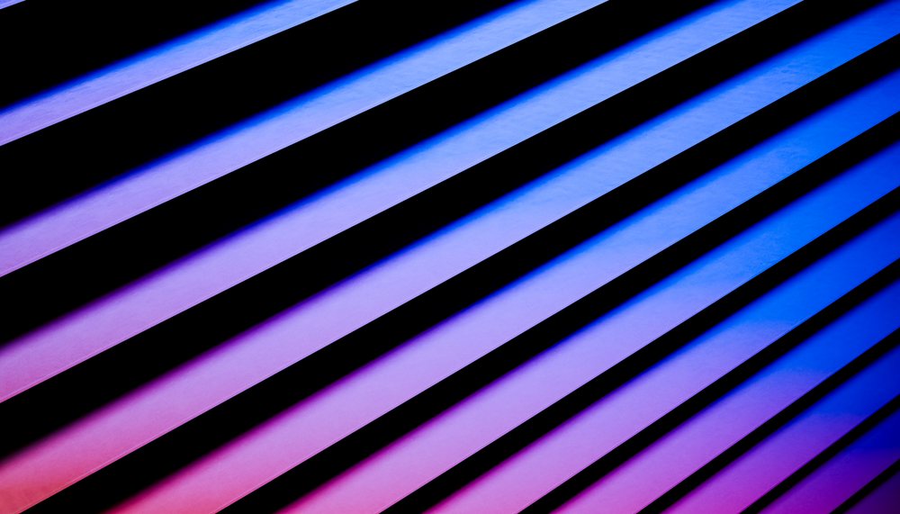 Abstract digital illustration showing diagonal lines with blue, purple, and pink gradient shadows in a contemporary style, render, wallpaper.